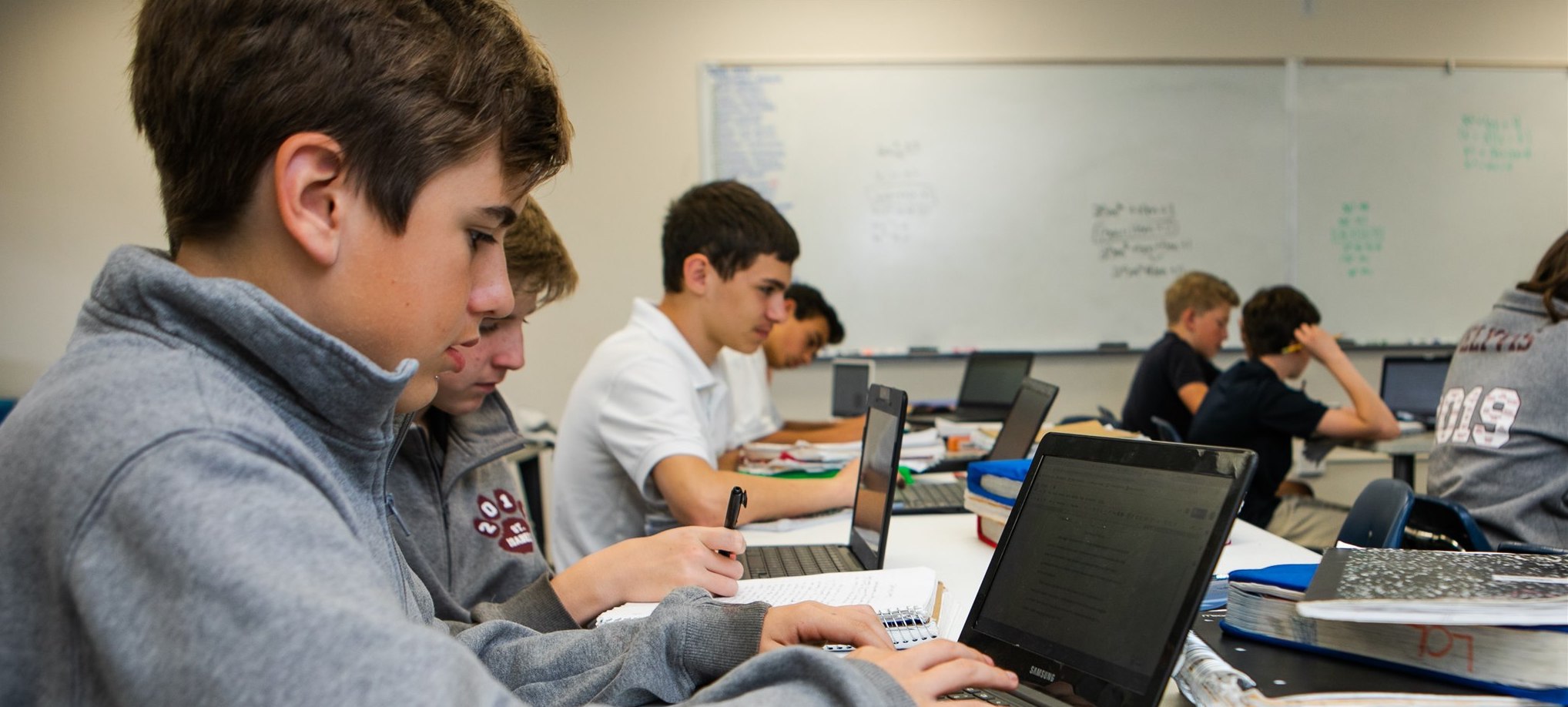 Students working in class with computers