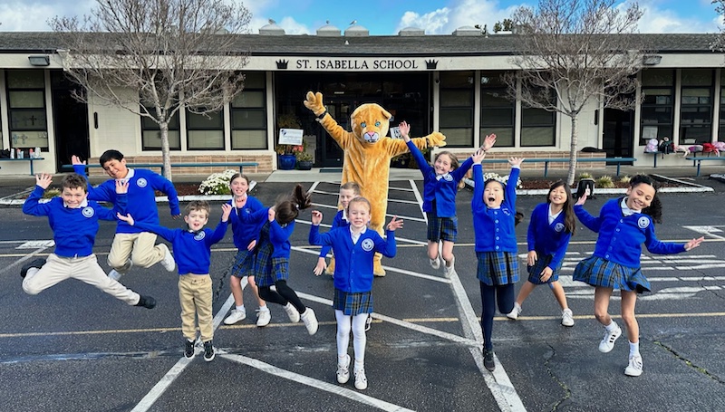 students jumping in playground